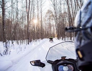 4c87dd99-de06-49c8-a058-7ccf5c2dd880-067-friends-snow-mobile-though-the-northwoods-in-st
